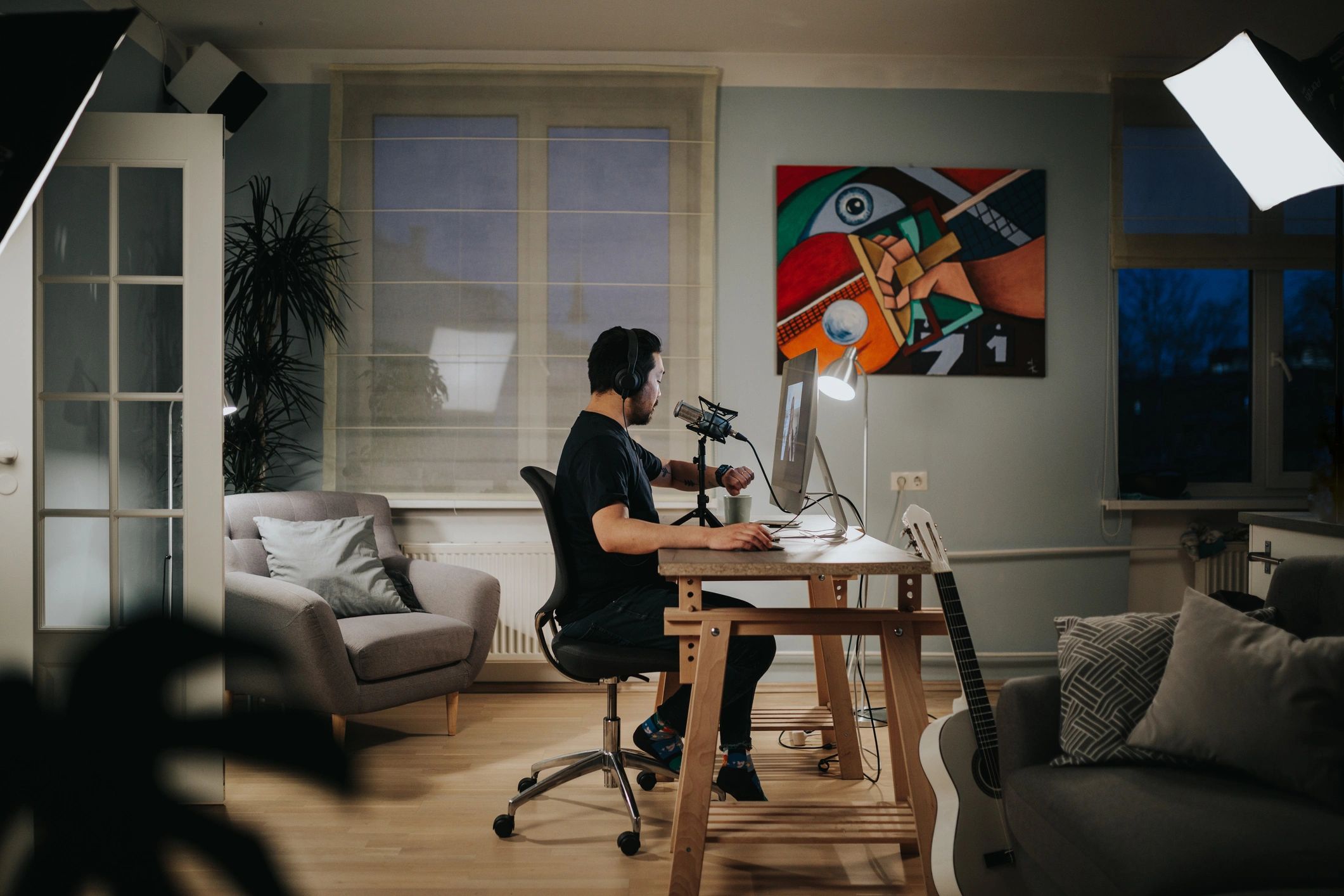 Podcaster recording an episode in a home studio