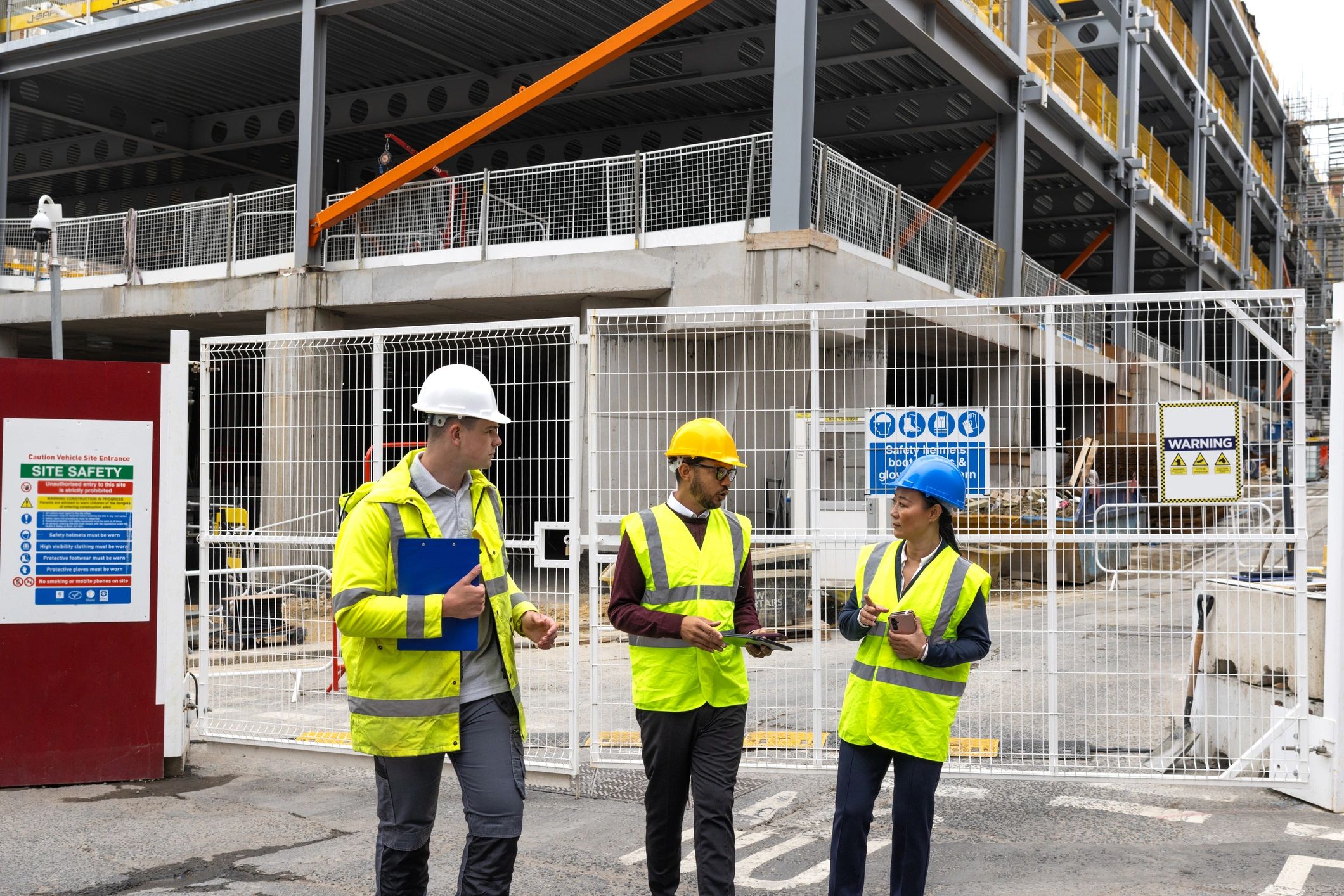 Safety professionals discussing plans at a worksite